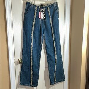 Pretty Little Thing Mid Blue Wash Denim  Lace-Up Jeans with Fray Details